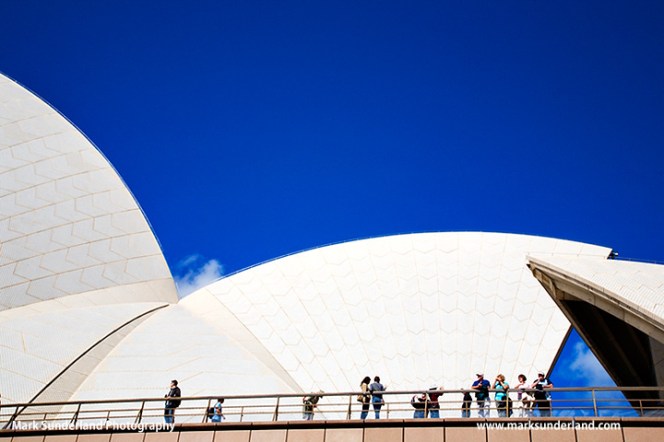 People looking over railings at the Opera House Sydney New South Wales Australia