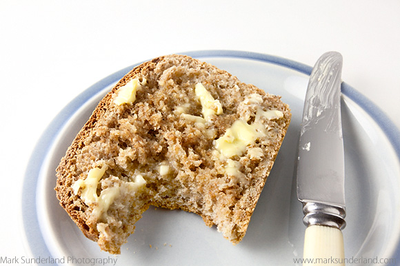 Slice of Freshly Baked Warm Wholemeal Bread with Butter 