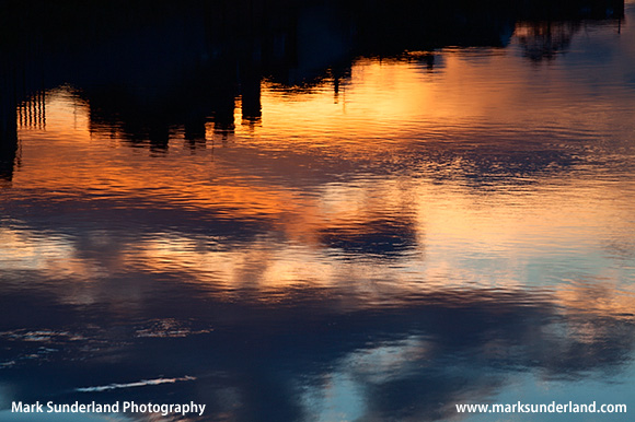 Urban Reflections in the River Aire at Sunset Castleford Yorkshire England