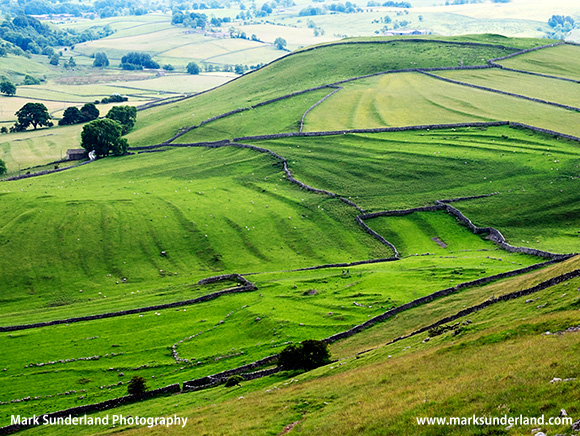 Meadows and Dry Stone Walls from above Gordale Scar near Malham Yorkshire Dales England