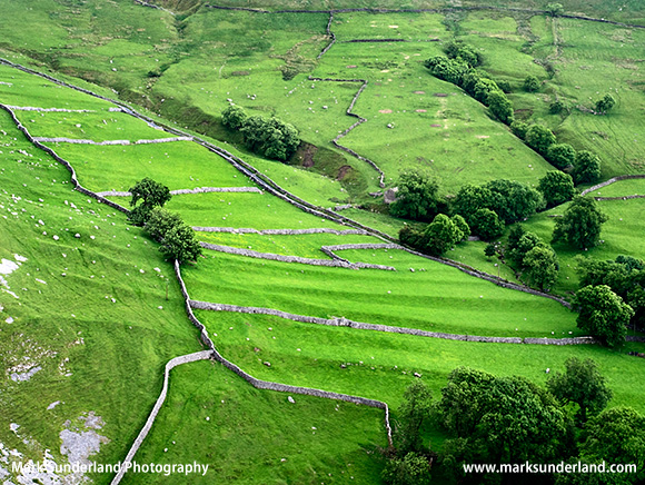 Meadows and Dry Stone Walls from above Gordale Scar near Malham Yorkshire Dales England