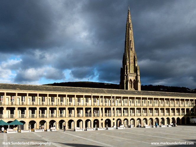 Stormy sky and sunlight on the Piece Hall in Halifax