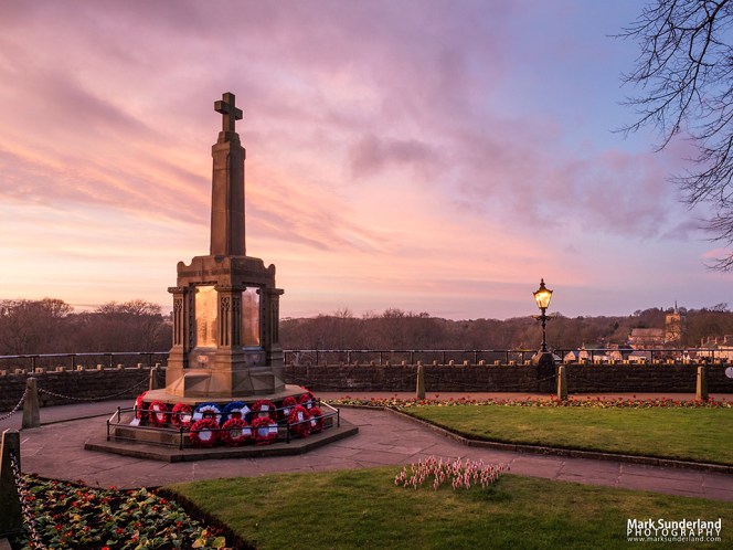 Pink sky at dusk over the War Memorial in the Castle Grounds at Knaresborough