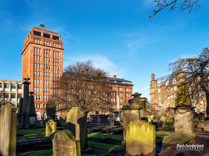 DC Thompson Courier Office building from The Howff historic burial ground in Dundee Scotland